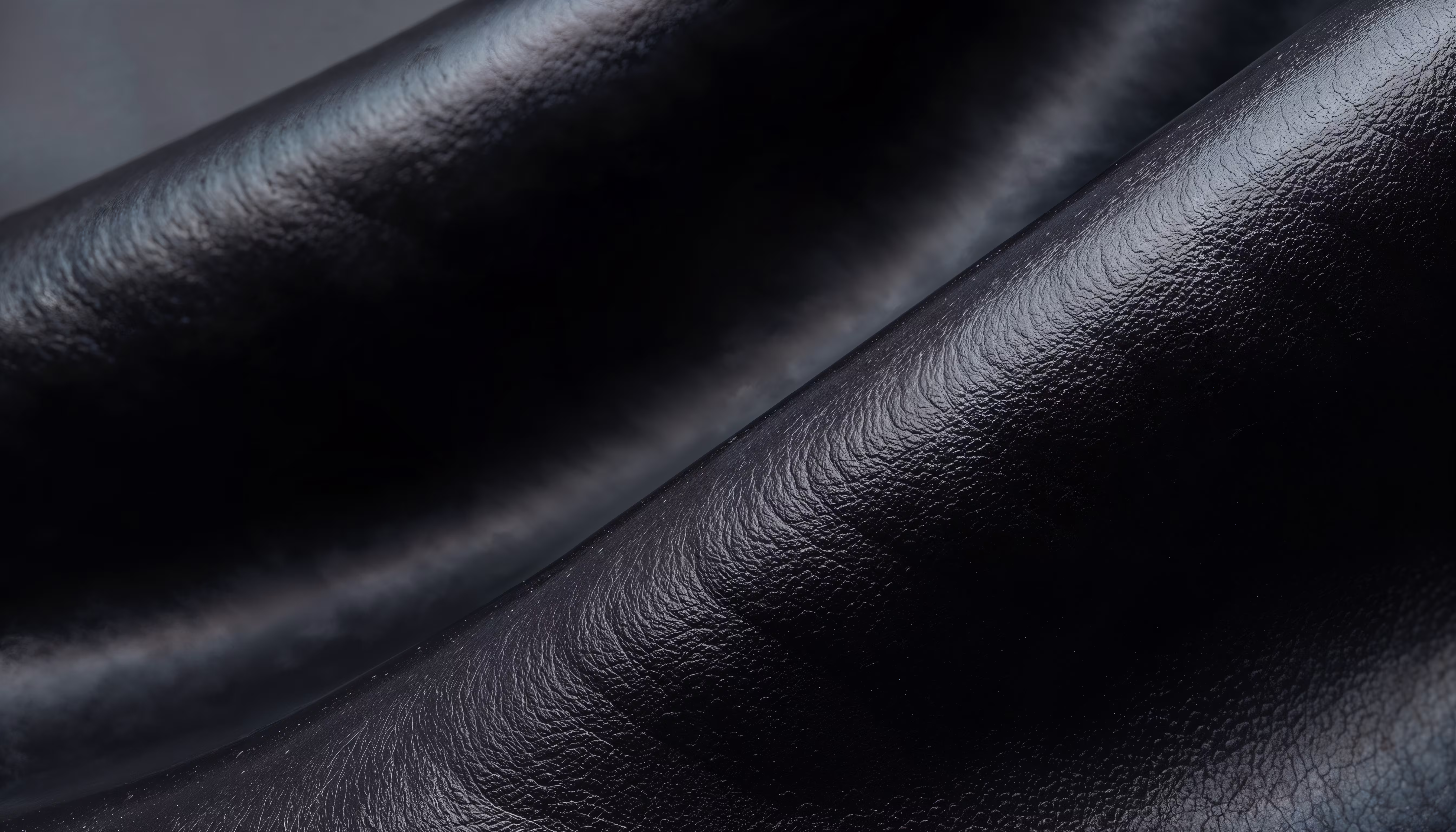 Black rexine faux leather closeup texture for upholstery — Ankur Textile Delhi